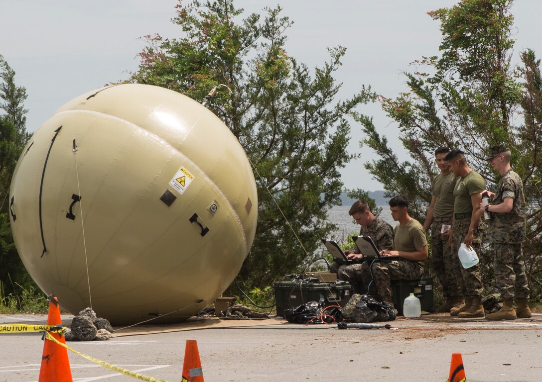 U.S. Marines with 2nd Radio Battalion, II Marine Expeditionary Force Information Group, set up network satellite communications through a Ground Antenna Transmit and Receive during a Command Post Exercise (CPX) at Camp Lejeune, N.C., May 21, 2018. 2nd Radio Battalion conducted the CPX to evaluate and improve their communication capabilities in preparation for an upcoming Mission Rehearsal Exercise. (U.S. Marine Corps photo by Lance Cpl. Tiana Boyd)