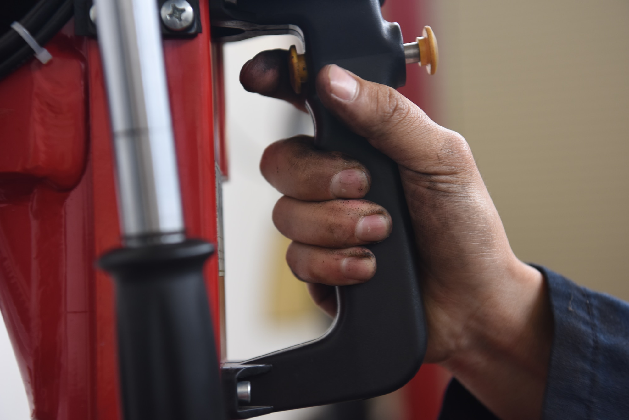 Airman 1st Class Jacobo Abeytia, 30th Logistics Readiness Squadron vehicle maintenance apprentice, removes the rim from the wheel during a routine tire change, May 29, 2018 at Vandenberg Air Force Base, Calif. A vehicle maintenance apprentice practices where an automobile is serviced on a regular basis to prevent a major breakdown or the need for major repair. (U.S. Air Force photo by Airman Aubree Milks/Released)