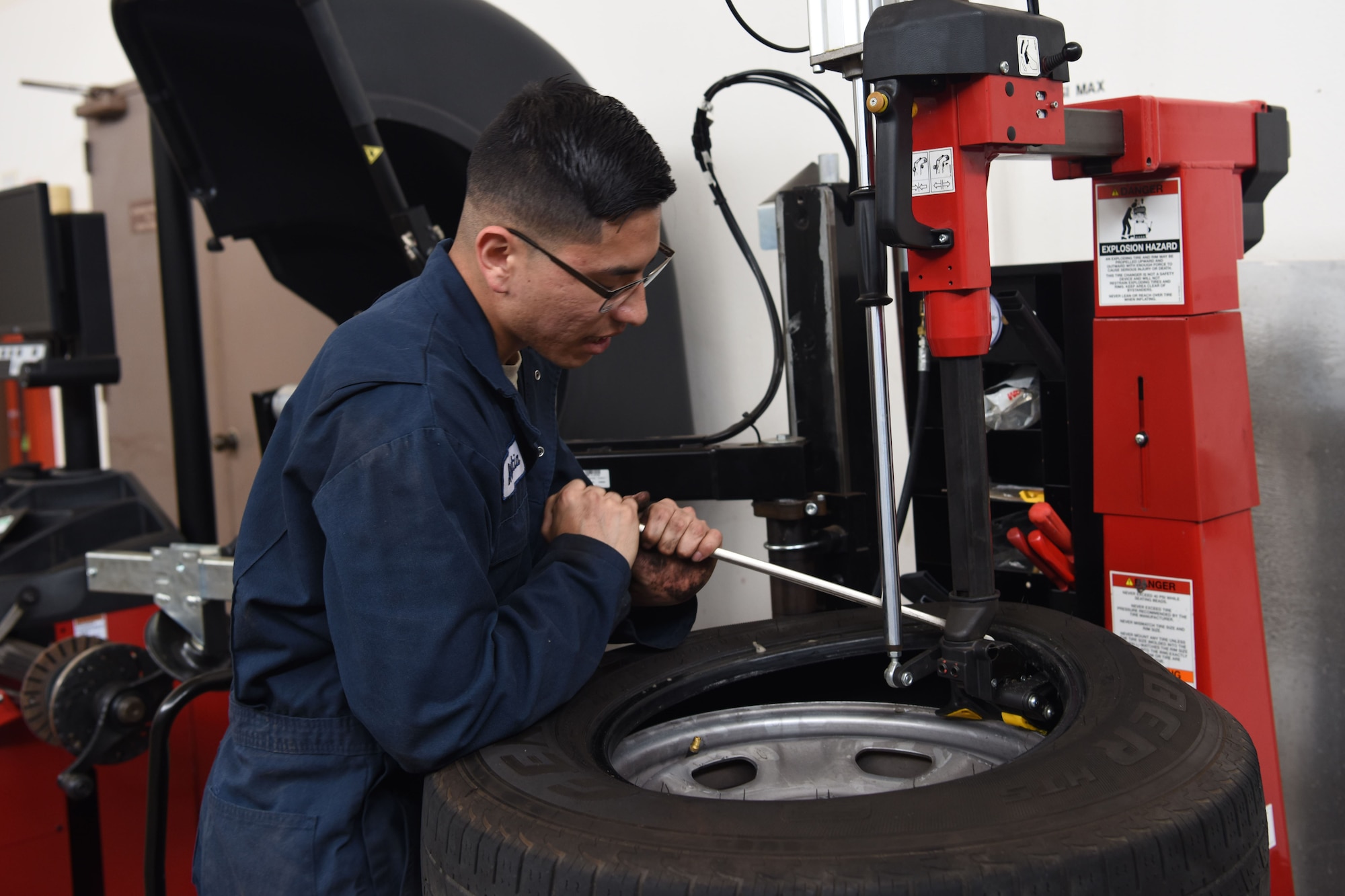 Airman 1st Class Jacobo Abeytia, 30th Logistics Readiness Squadron vehicle maintenance apprentice, completes a wheel during a routine tire change, May 29, 2018 at Vandenberg Air Force Base, Calif. A vehicle maintenance apprentice practices where an automobile is serviced on a regular basis to prevent a major breakdown or the need for major repair. (U.S. Air Force photo by Airman Aubree Milks/Released)