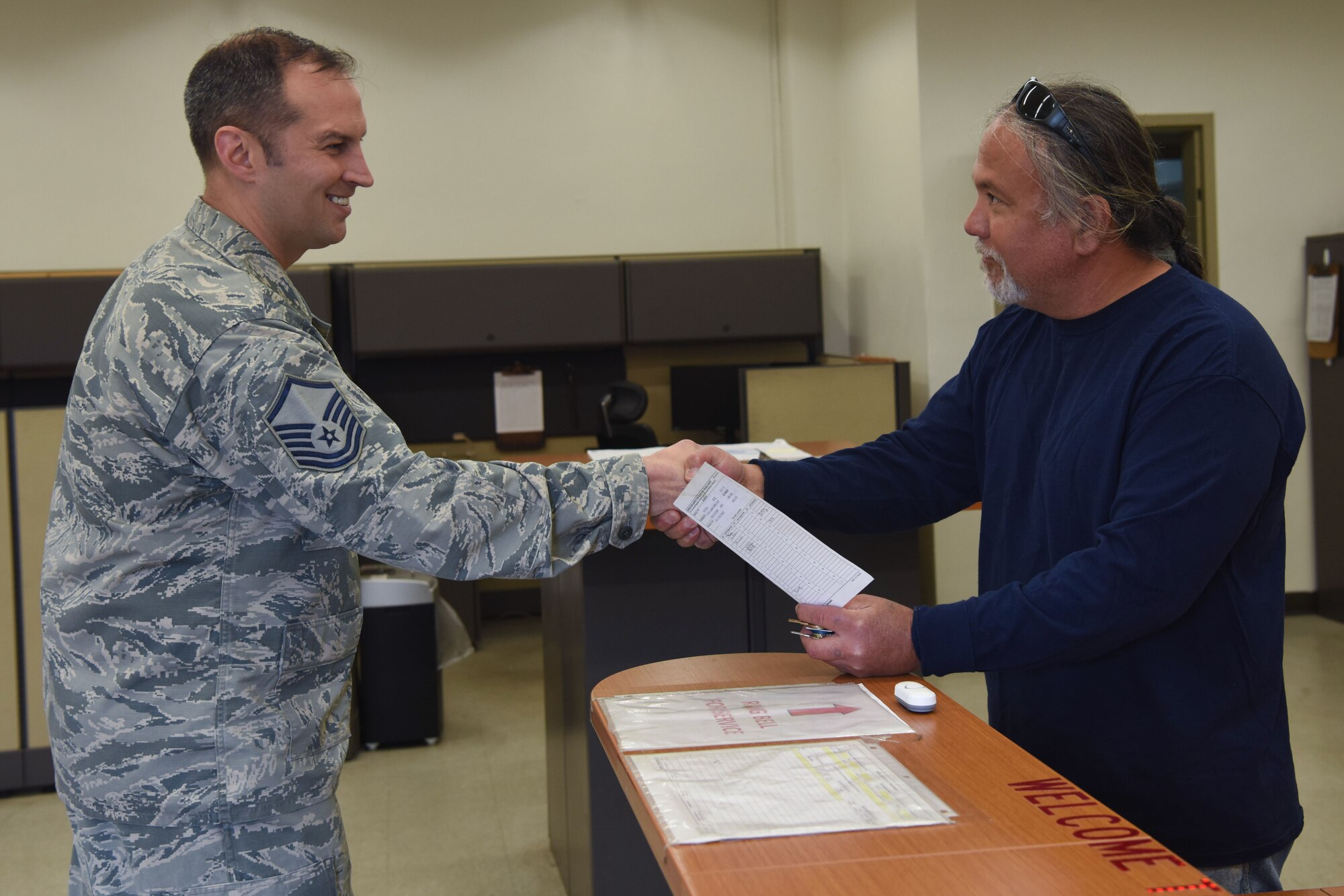 Master Sgt. Keith Pierson, 30th Logistic Group Readiness Vehicle superintendent, thanks 30th LRS customer service for the job well done on his vehicle, May 29, 2018 at Vandenberg Air Force Base, Calif. Pierson came to 30th LRS with a flat tire and the squadron was able to fix it within the hour. (U.S. Air Force photo by Airman Aubree Milks/Released)