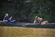 From left, Nicholas Burney, 14, and Cortavious Jones, 13, Fort Eustis Boy Scouts Troop 45 members, pick trash out of Eustis Lake during Clean the Bay Day at Joint Base Langley-Eustis, Virginia, June 2, 2018. Troop 45 members worked to clear the lake of trash, and are thinking of new ways to help clean up Fort Eustis. (U.S. Air Force photo by Airman 1st Class Monica Roybal)