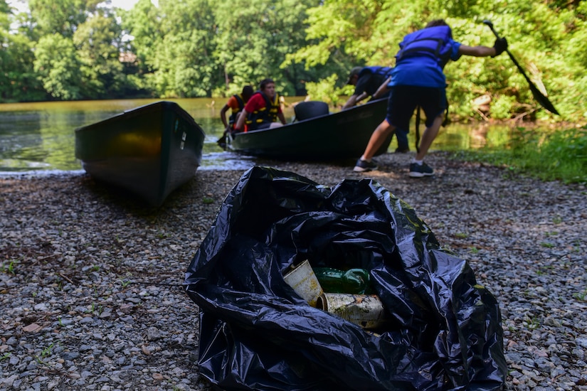 Fort Eustis Boy Scouts Troop 45 members pull a canoe out of Eustis Lake during a Clean the Bay at Joint Base Langley-Eustis, Virginia, June 2, 2018. The 733rd Civil Engineer Division Environmental Element hosted the event to help preserve parts of the Chesapeake Bay. (U.S. Air Force photo by Airman 1st Class Monica Roybal)