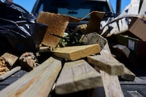 Trash and debris are placed in the bed of a truck during Clean the Bay Day at Joint Base Langley-Eustis, Virginia, June 2, 2018. The Chesapeake Bay Foundation’s 30th Annual Clean the Bay Day consisted of approximately 6,000 volunteers who covered more than 300 miles of shoreline and collected up of more than 128,000 pounds of trash and debris. (U.S. Air Force photo by Airman 1st Class Monica Roybal)