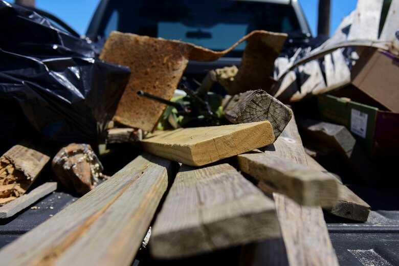 Trash and debris are placed in the bed of a truck during Clean the Bay Day at Joint Base Langley-Eustis, Virginia, June 2, 2018. The Chesapeake Bay Foundation’s 30th Annual Clean the Bay Day consisted of approximately 6,000 volunteers who covered more than 300 miles of shoreline and collected up of more than 128,000 pounds of trash and debris. (U.S. Air Force photo by Airman 1st Class Monica Roybal)