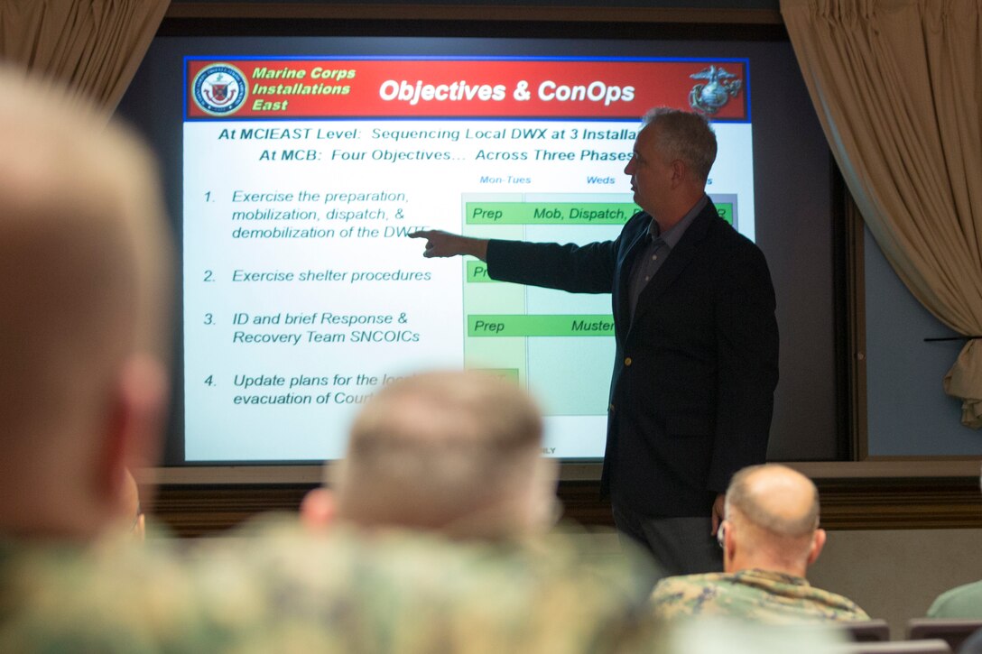 John Reeve, operations officer for Marine Corps Installations East, Marine Corps Base Camp Lejeune, briefs the base’s staff on its annual destructive weather exercise at building 1 on MCB Camp Lejeune, May 31. Hurricane Season begins on June 1 and extends to Nov. 30. (Marine Corps Photo by Lance Cpl. Nathan Reyes)
