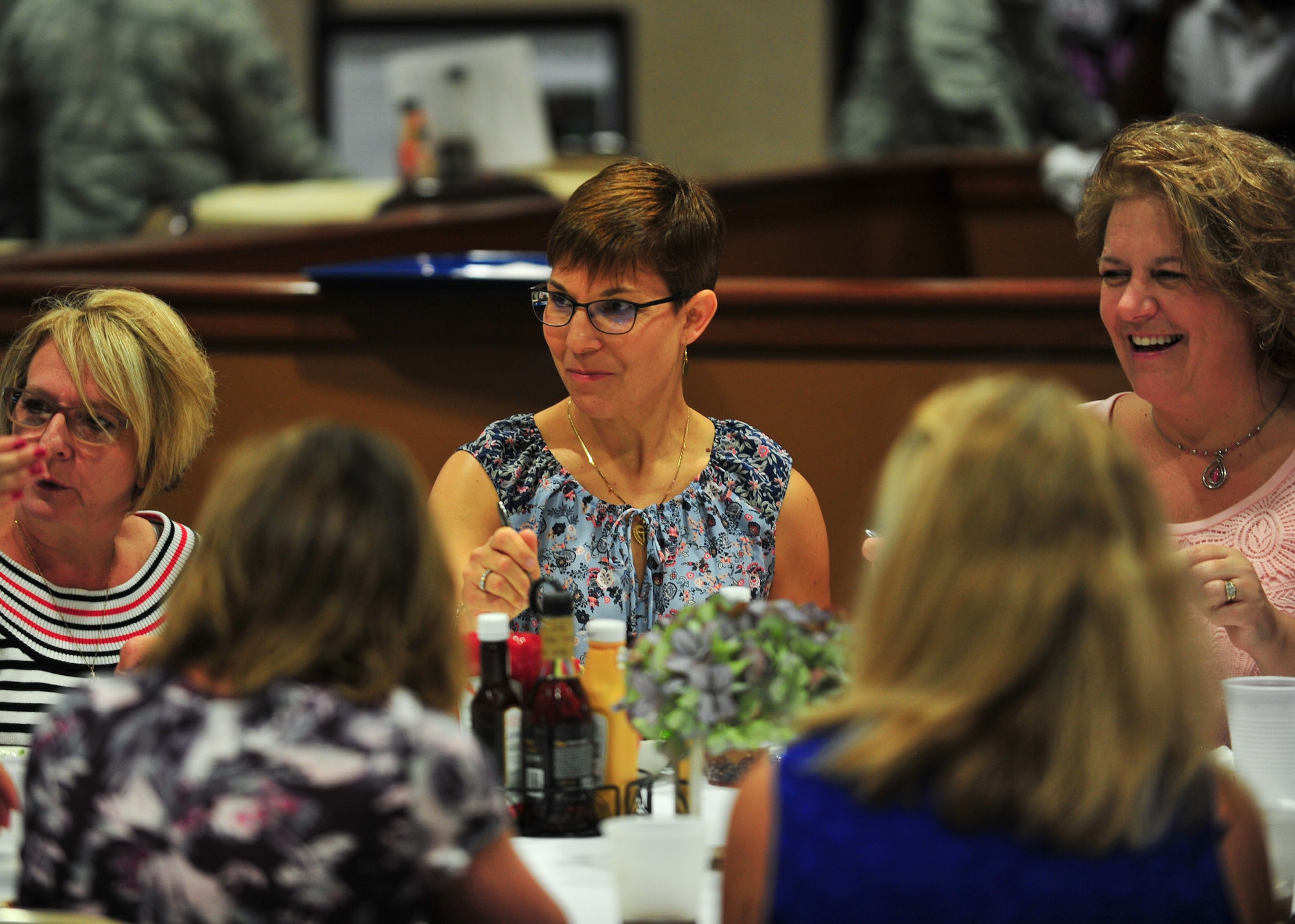 Jill La Fave, a 22nd Air Force Key Spouse and wife of Maj. Gen. Craig La Fave, 22nd AF commander, chats with 11 of the 910th Airlift Wing’s Key Spouses during a luncheon at the Community Activities Center, June 2, here.