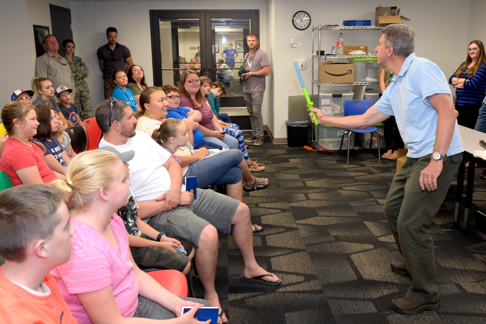 Mark Standing, Director of Education at the Hill Aerospace Museum, demonstrates static electricity to kids and parent visitors, June 5, 2018, at Hill Air Force Base, Utah. The museum is offering free classes related to science, technology, engineering and math through the summer to children at least 8 years of age. (U.S. Air Force photo by Todd Cromar)