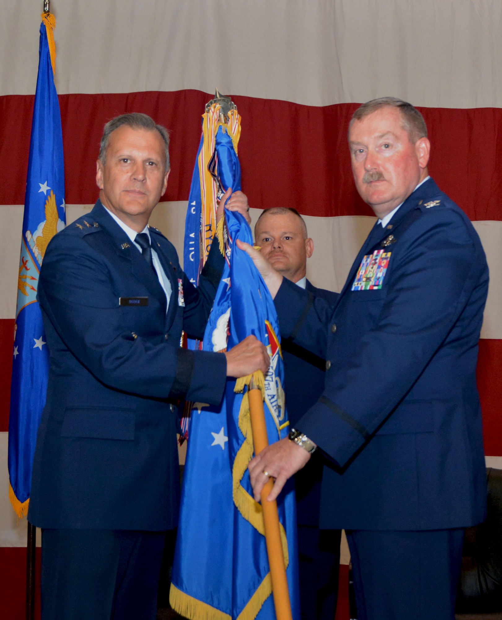 Maj. Gen. Randall Ogden, Fourth Air Force commander, accepts the 507th Air Refueling Wing flag from Col. Douglas Gullion, former 507th ARW commander, during a change of command ceremony June 3, 2018, at Tinker Air Force Base, Okla. Gullion served as commander of the 507th ARW for two years. (U.S. Air Force photo/Tech. Sgt. Samantha Mathison)