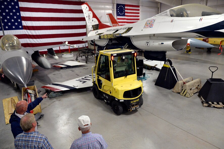 Hill Aerospace Museum staff and volunteers reposition an F-16 wing to be installed on a static display aircraft May 29, 2018, at Hill Air Force Base, Utah. Now located at the east end of the museum’s fighter gallery, the former Thunderbird F-16A aircraft will be on display for visitors. (U.S. Air Force photo by Todd Cromar)