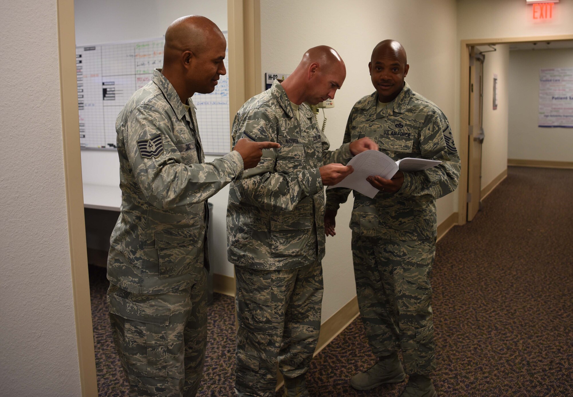 Master Sgt. Thee Thorpe, 90th Medical Group First Sergeant talks to 90th Medical Readiness Flight chief Master Sgt. Jeffery Naughton, and NCO in Charge Tech. Sgt. Josue Diaz June 6, 2018, in the 90th Medical Group Building on F.E. Warren Air Force Base, Wyo. Thorpe schedules time each day to get up and walk around to meet and chat with the people in his group to build trust and confidence between him and his fellow Airmen. Thorpe suggests it will improve leadership skills, personal skills and communication.  (U.S. Air Force photo by Airman 1st Class Braydon Williams)