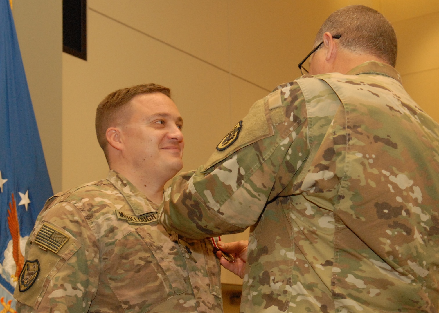 Army Lt. Col. Paul V. McCullough III is pinned with the Defense Meritorious Service Medal by Army Brig. Gen. Mark Simerly, DLA Troop Support commander, during a quarterly awards ceremony May 30. McCullough’s award was in recognition of his deployment as the commander of the DLA Support Team in Kuwait in 2017.