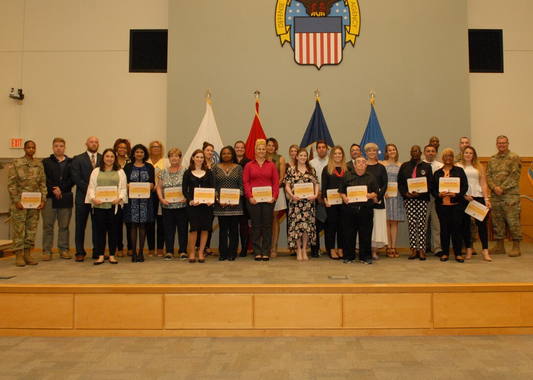 Volunteers for the annual Take Our Daughters and Sons to Work Day event were recognized with a Certificate of Appreciation during a quarterly awards ceremony May 30. The ceremony recognized more than 100 individuals.