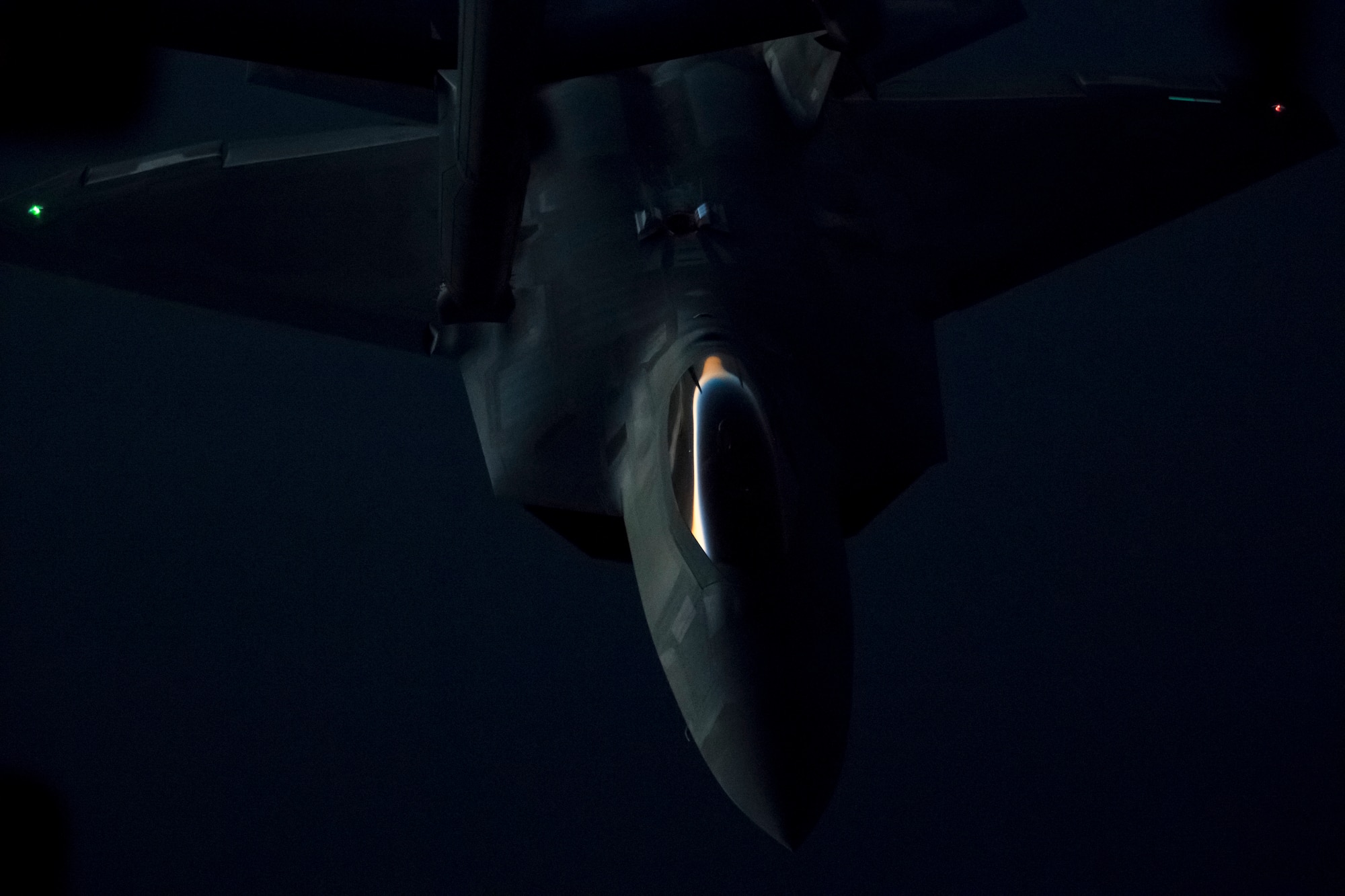 A U.S. Air Force F-22 Raptor from the 94th Expeditionary Fighter Squadron prepares to receive fuel from a 908th Expeditionary Air Refueling Squadron KC-10 Extender over the skies of Southwest Asia, June 4, 2018. (U.S. Air Force photo by Tech. Sgt. Nieko Carzis)