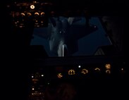 A U.S. Air Force F-22 Raptor from the 94th Expeditionary Fighter Squadron prepares to receive fuel from a 908th Expeditionary Air Refueling Squadron KC-10 Extender over the skies of Southwest Asia, June 4, 2018. (U.S. Air Force photo by Tech. Sgt. Nieko Carzis)