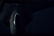 A U.S. Air Force F-22 Raptor from the 94th Expeditionary Fighter Squadron prepares to receive fuel from a 908th Expeditionary Air Refueling Squadron KC-10 Extender over the skies of Southwest Asia, June 4, 2018. (U.S. Air Force photo by Tech. Sgt. Nieko Carzis)