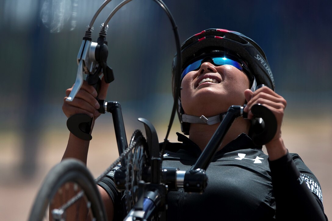 Army Sgt. 1st Class Hyoshin Cha powers a hand cycle up the final hill during the 2018 Department of Defense Warrior Games time trials competition at the U.S. Air Force Academy in Colorado Springs, Colo., June 6, 2018. DoD photo by EJ Hersom