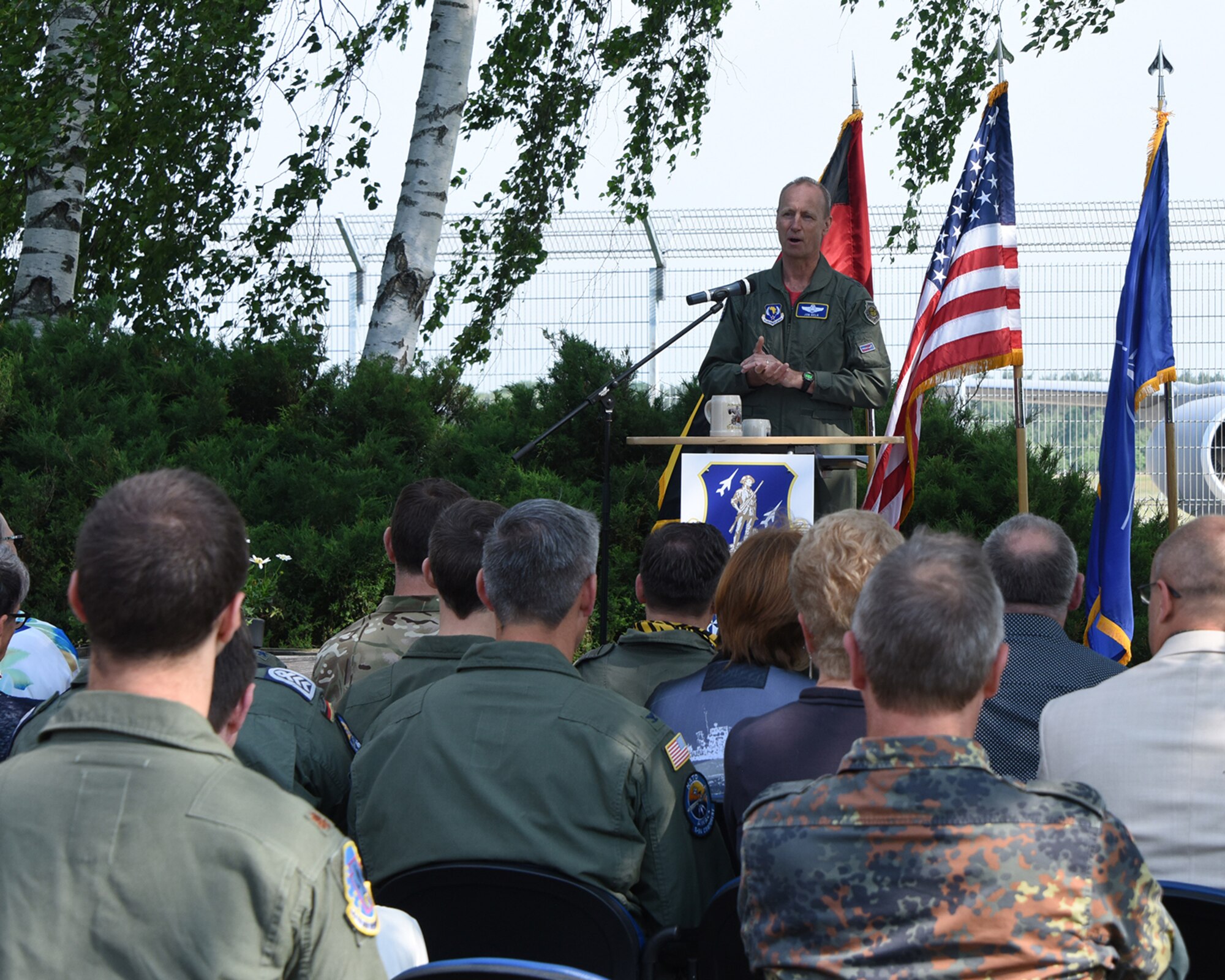 Maj. Gen. Jon Kelk, Air National Guard Assistant to Commander, U.S. Air Forces in Europe-Air Forces Africa, Maj. Gen. Dawn Dunlop, Commander, NATO Airborne Early Warning and Control Force (NAEW&C), and Brig. Gen. Karsten Stoye, Commander NATO E-3A Component attend a ceremony commemorating 25 years of partnership between NATO Airborne Early Warning and Control Force (NAEW&CF) and the U.S. Air National Guard in Geilenkirchen, Germany May 24, 2018.