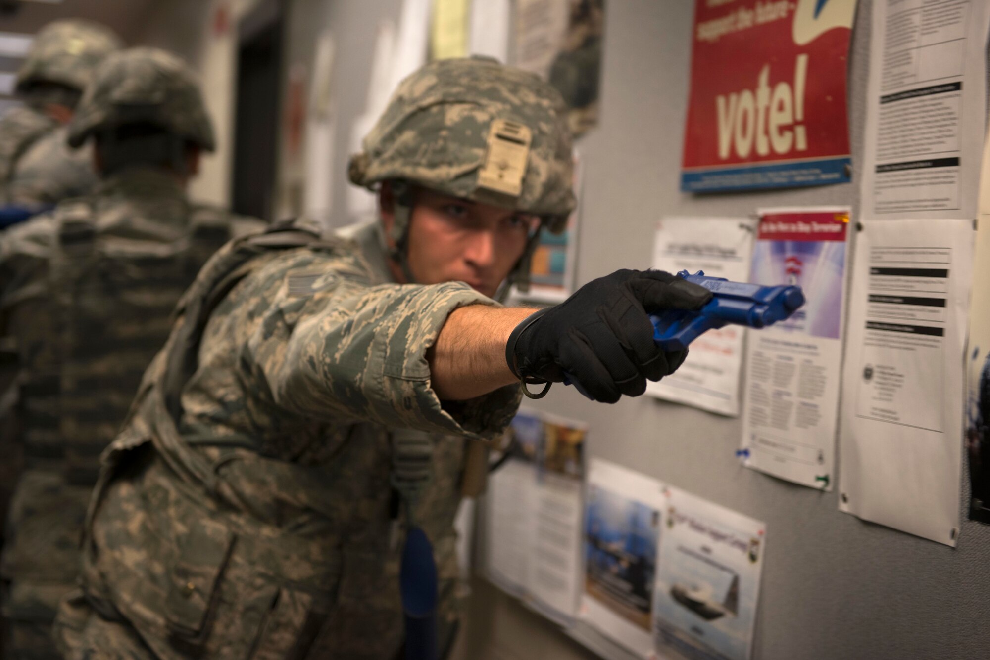 Staff Sgt. James Mcarthur, 934th Security Forces Squadron fire team member, provides rear fire cover for his team during room clearing training at Minneapolis Air Reserve Station, Minn., June 3, 2018. Airmen from the 934th SFS participated in a variety of quarterly training exercises to sharpen required job skills. (U.S. Air Force Photo by Tech. Sgt. Amber E. N. Jacobs)