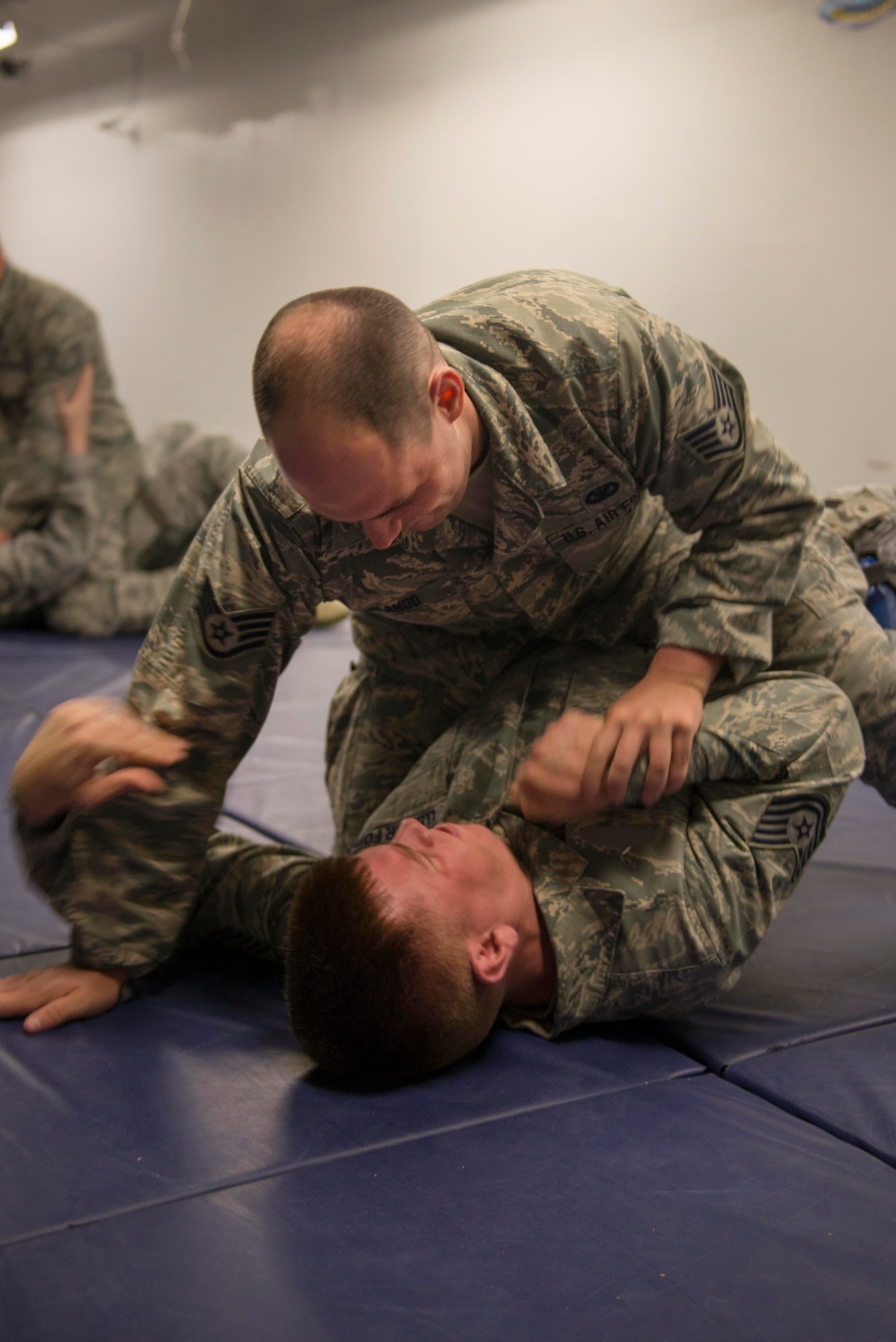 Staff Sgt. Bradley Orlando and Tech Sgt. Chris Orr, 934th Security Forces Squadron fire team members, practice weapon retention training at Minneapolis Air Reserve Station, Minn., June 3, 2018. Airmen from the 934th SFS had to prevent their weapons from being taken by an advisory as part of training scenario. (U.S. Air Force Photo by Tech. Sgt. Amber E. N. Jacobs)