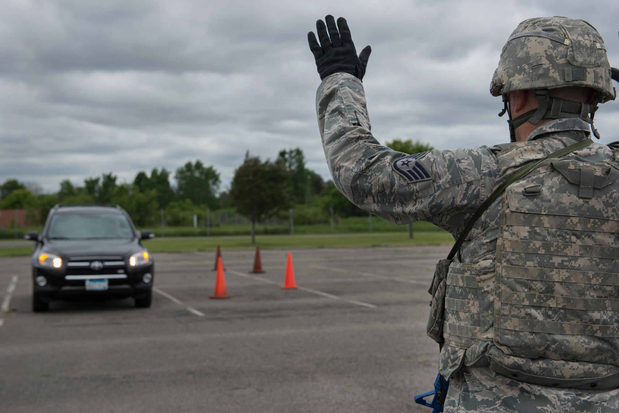 Staff Sgt. Robert Smolen, 934th Security Forces Squadron member, stops a vehicle during entry control point training at Minneapolis Air Reserve Station, Minn., June 3, 2018. Airmen from the 934th SFS participated in a variety of quarterly training exercises to sharpen required job skills. (U.S. Air Force Photo by Tech. Sgt. Amber E. N. Jacobs)
