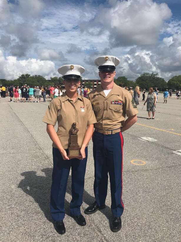 Private First Class Megan Srp poses for a photo with her recruiter, Gunnery Sgt. Justin Kellykurth, after her graduation ceremony at Marine Corps Recruit Depot Parris Island, S.C., May 25th, 2018. Srp’s drill instructors selected her as the company honor graduate because of her superior leadership abilities and her potential to continue to lead Marines in the future. Srp is a Ladysmith, Wis., native.