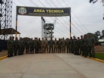 Sgt. 1st Class Héctor Guillén, West Virginia National Guard State Partnership Program coordinator and Peru native, poses with members of the U.S. Army South Non-commissioned officer (NCO) professional development team and Peruvian Army June 1, 2018 in Lima, Peru. Guillén provided training in Spanish on NCO leadership and development to the Peruvian Army.