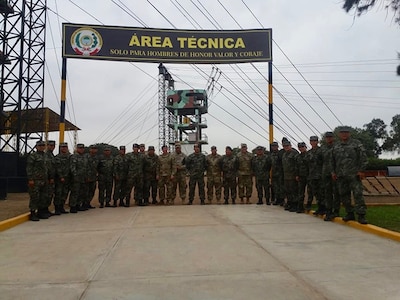 Sgt. 1st Class Héctor Guillén, West Virginia National Guard State Partnership Program coordinator and Peru native, poses with members of the U.S. Army South Non-commissioned officer (NCO) professional development team and Peruvian Army June 1, 2018 in Lima, Peru. Guillén provided training in Spanish on NCO leadership and development to the Peruvian Army.