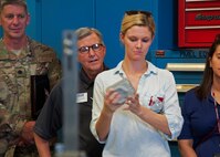A local area employer examines a sample piece of fabricated metal during a tour of the 919th Special Operations Maintenance Squadron's metals technology shop June 4, 2018 at Duke Field, Fla.