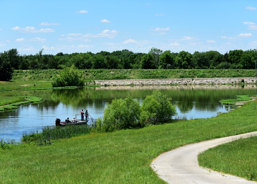 Members of the 509th Civil Engineer Squadron natural resources section and the Missouri Department of Conservation survey the fish population in the North Lake at Whiteman Air Force Base, Missouri, June 5, 2018. The team also evaluated the Ike Skelton, Bear and Nugent Lakes on base to measure the amount of algae present and water temperature to ensure a balanced ecosystem. (U.S. Air Force photo by Staff Sgt. Danielle Quilla)