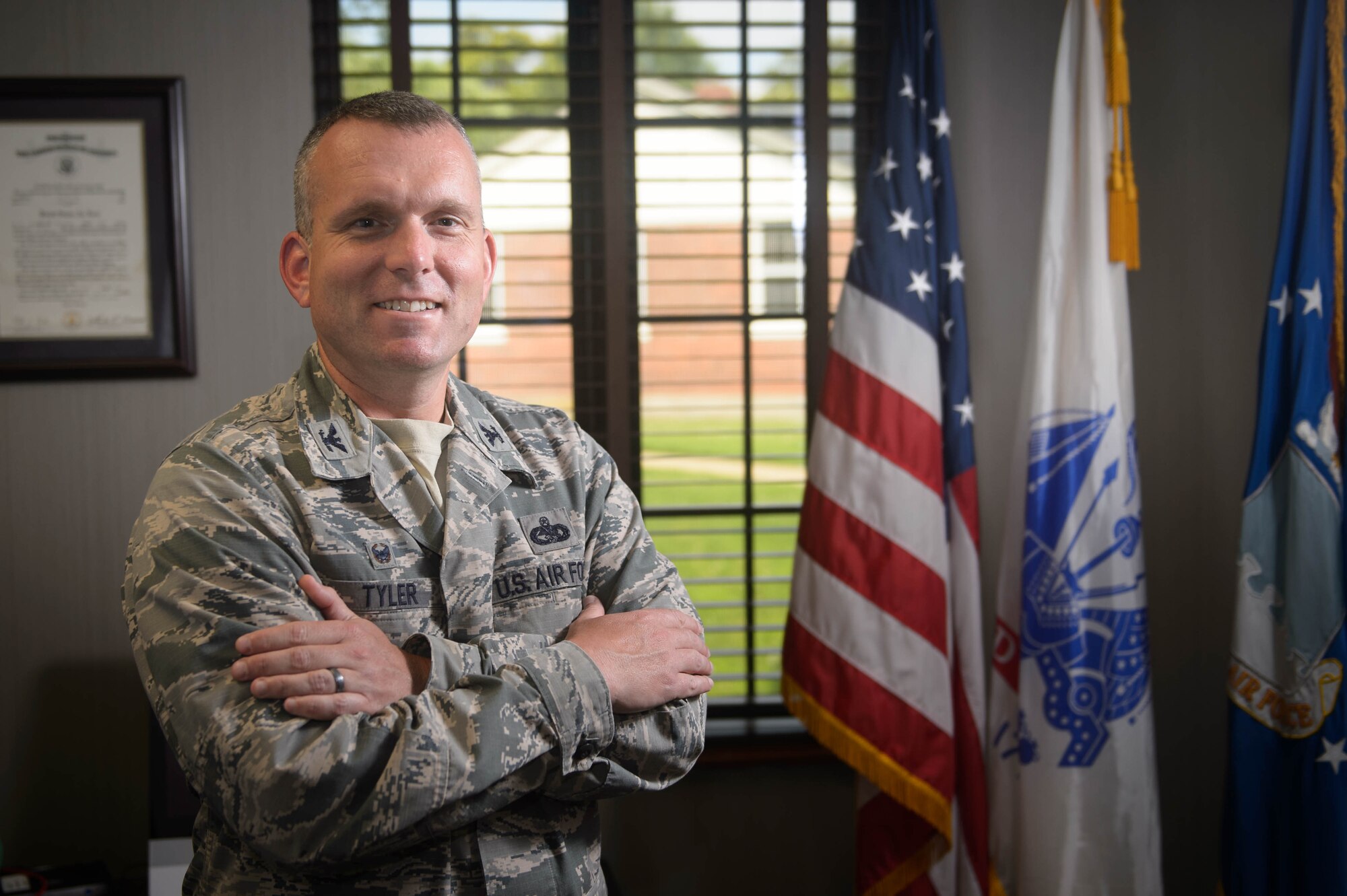 U.S. Air Force Col. Sean Tyler, 633rd Air Base Wing commander, stands in his office at Joint Base Langley, Va., June 6, 2018.