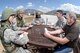 (Left to right) Airman 1st Class Allison West and Staff Sgt. Andrew Dowling, Contracting Directorate, and Master Sgt. Tamika Felder 388th Finance Management, negotiate with Master Sgt. Christopher Castro, Contracting Directorate superintendent, and Marc Mattson, also Contracting Directorate, during a field exercise May 3, 2018, at Hill Air Force Base, Utah. (U.S. Air Force photo by Todd Cromar)