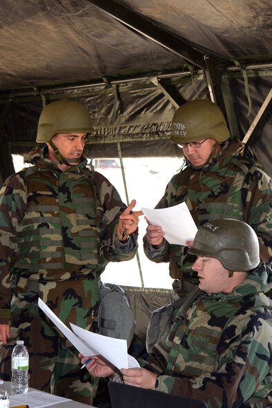 (Left to right) Capt. Antonio McCartney, Staff Sgt. Andrew Dowling and Capt. Alan Davis, Contracting Directorate, practice contracting work in a “deployed environment” during a field exercise May 3, 2018, at Hill Air Force Base, Utah. (U.S. Air Force photo by Todd Cromar)