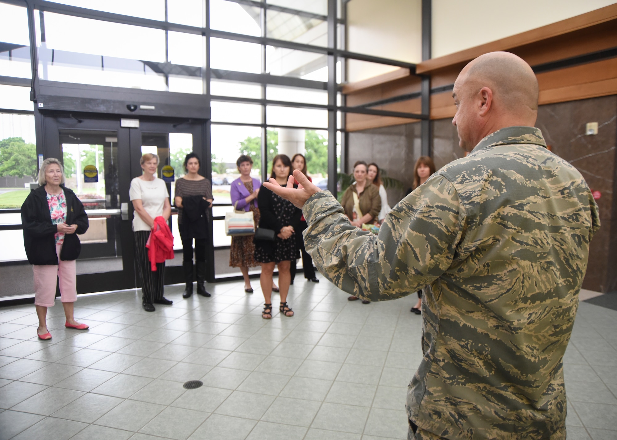 Lt. Col. Brooks Wilkerson, Air Force Mortuary Affairs Operations deputy commander, speaks to volunteers with the Friends of the Fallen during their visit