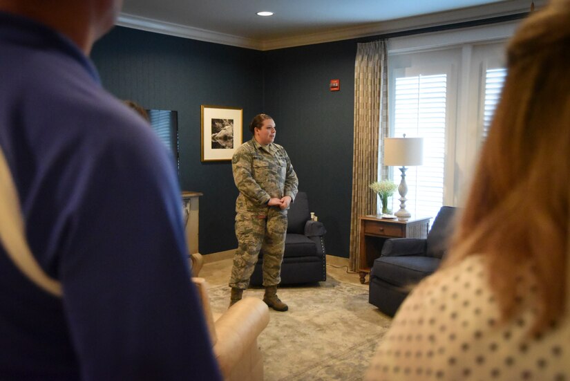 Tech. Sgt. Dorothy Whitfield briefs volunteers during a visit to the Fisher House for Families of the Fallen.