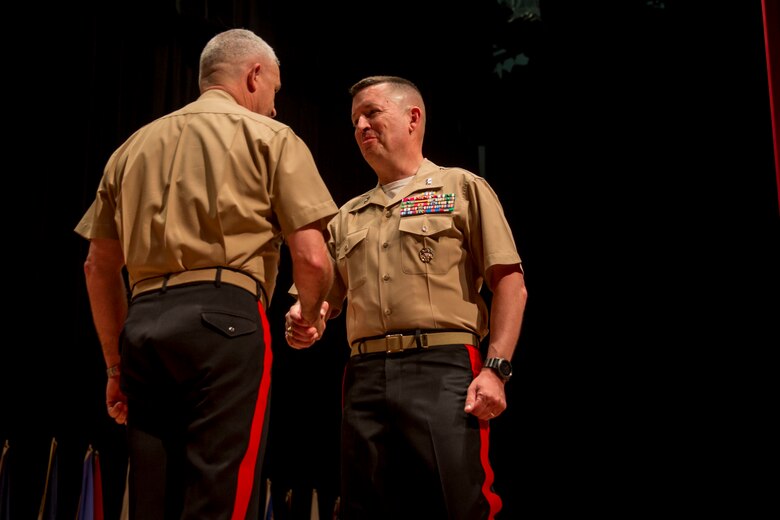 Major General James W. Bierman, Jr., shakes hands with Maj. Gen. Paul J. Kennedy during the Marine Corps Recruiting Command change of command ceremony at Warner Hall, Marine Corps Base Quantico, Virginia, June 7, 2018.  The ceremony signified the transfer of command from Kennedy to Bierman. (U.S. Marine Corps Photo by Staff Sgt. John A. Martinez Jr.)