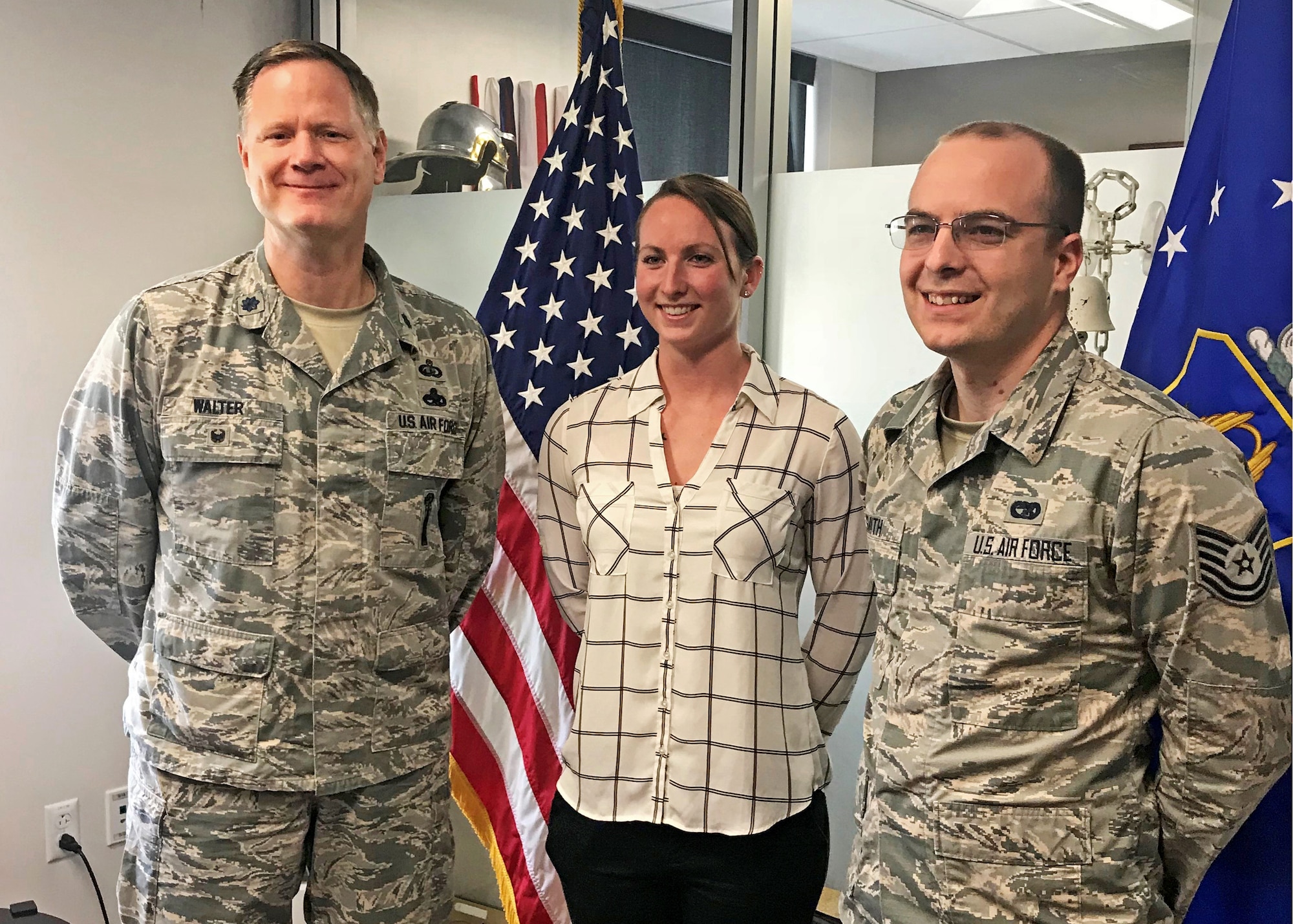 Lt. Col. Joseph Walter, wing process manager for the 442d Fighter Wing, soon-to-be 2nd Lt. Margaret "Maggie" Ann Atkins and Tech. Sgt. Michael Smith, Officer Accessions recruiter at Scott AFB, pose for a photo after Atkins takes the oath of enlistment at Whiteman Air Force Base, May 21, 2018.