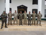 Sgt. 1st Class Héctor Guillén, West Virginia National Guard State Partnership Program coordinator and Peru native, poses with members of the U.S. Army South Non-commissioned officer (NCO) professional development team and Peruvian Army June 1, 2018 in Lima, Peru. Guillén provided training in Spanish on NCO leadership and development to the Peruvian Army.