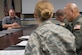 Stan Gohl, 437th Airlift Wing historian, presents the idea of placing stone beneath the heritage aircraft at the air park here during the Squadron Innovation Fund panel meeting June 4, 2018.