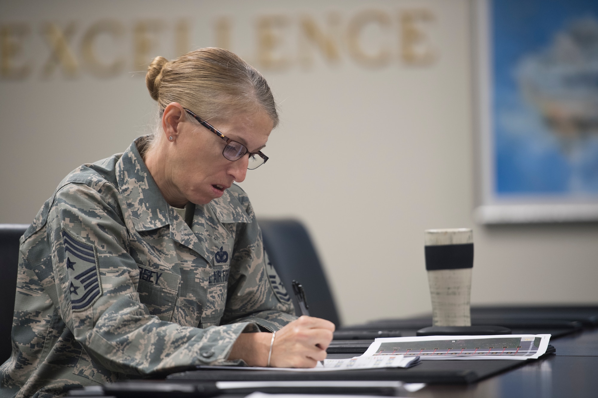 Chief Master Sgt. Jennifer Kersey, right, 437th AW command chief, takes notes during the Squadron Innovation Fund panel meeting June 4, 2018.