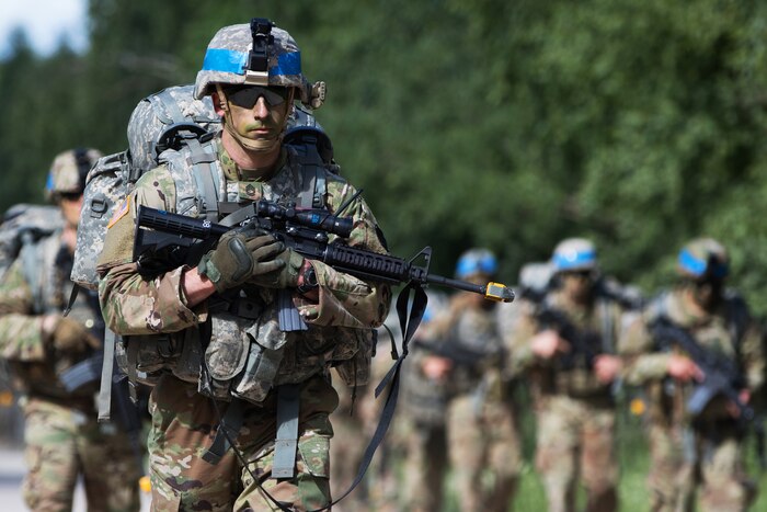 Soldiers conduct a ruck march during Saber Strike 18 at the Pabrade Training Area, Lithuania.