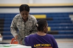 Capt. Nikita Dunbar, an Air National Guard critical-care nurse from the 187th Fighter Wing CERFP in Montgomery, Ala., takes a patient's blood pressure June 3, 2018, at the Alabama Wellness Innovative Readiness Training at Monroe County High School in Monroeville, Ala. Air Guardsmen from Alabama and Wisconsin were part of the joint force participating in the two-week training that provided no-cost health care to the citizens of lower Alabama.