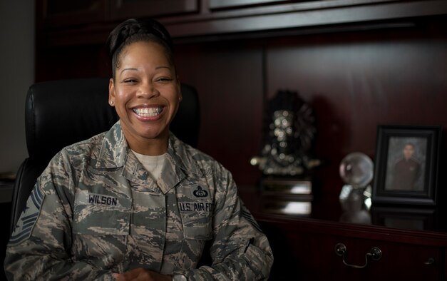 U.S. Air Force Chief Master Sgt. Yasmeen Wilson, 33rd Fighter Wing command chief, sits in her office May 9, 2018, at Eglin Air Force Base, Fla.  Wilson created a motivational group for women called W.I.N.G.S., "Women Inspiring the Next Generation's Successes," which focuses on personal and professional development, strengthens interpersonal communication skills, heightens self-awareness and encourages self-confidence. (U.S. Air Force photo by Airman 1st Class Daniella Peña-Pavao)
