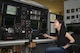 B-52H Mission Planning Environment Team Electronics Engineer Nhi Dinh works on Tinker Air Force Base's B-52 simulator designed to test the B-52H MPE team's new coding and upgrades to the U.S. Air Force's B-52 fleet of bombers.