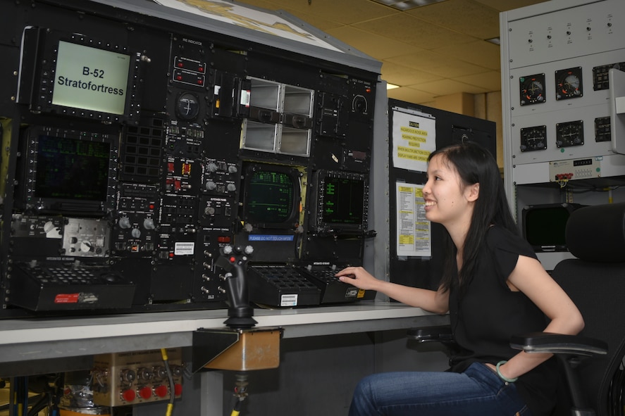 B-52H Mission Planning Environment Team Electronics Engineer Nhi Dinh works on Tinker Air Force Base's B-52 simulator designed to test the B-52H MPE team's new coding and upgrades to the U.S. Air Force's B-52 fleet of bombers.