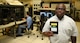 Emmanuel Koomson, 557th Software Maintenance Squadron lead test engineer holds a data transfer cartridge for the B-52H which contains the latest software upgrades developed by his team in the Mission Planning Environment section in the B-52 software test lab on May 29, 2018, Tinker Air Force Base, Oklahoma.