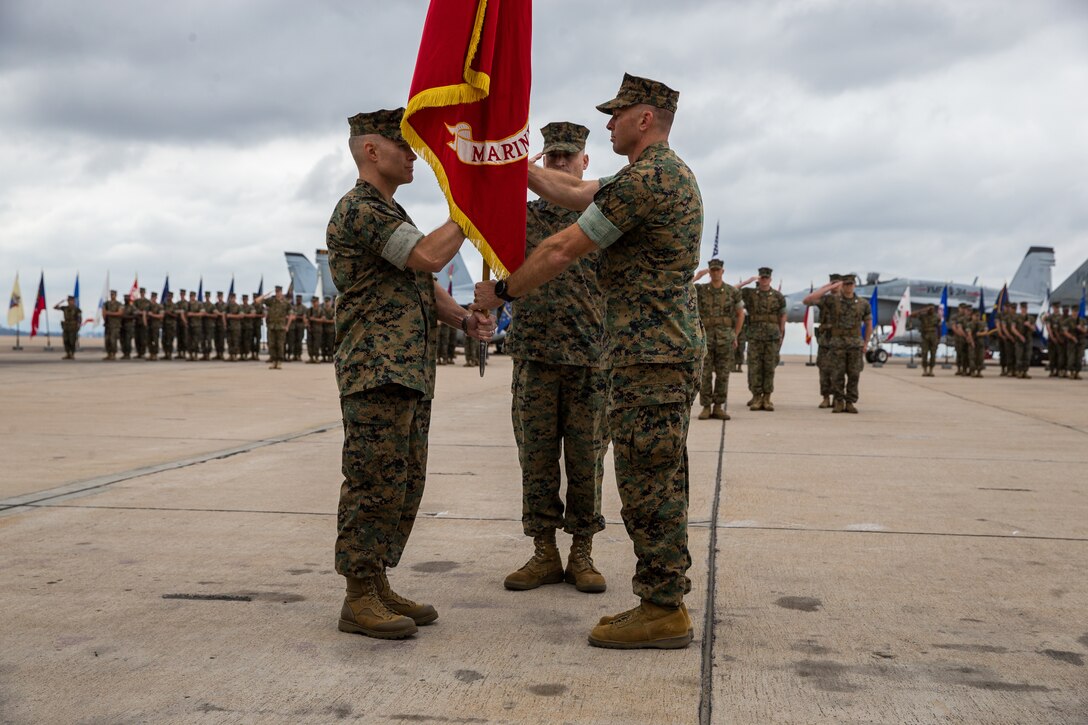 Lt. Col. Dustin J. Byrum, the outgoing Marine Fighter Attack Squadron (VMFA) 314 commanding officer, prepares to relinquish command to Lt. Col. Cedar L. Hinton during a change of command ceremony at Marine Corps Air Station Miramar, Calif., May 31. VMFA-314 was commissioned on October 1, 1943 at MCAS Cherry Point, N.C., and moved to MCAS Miramar in February of 1996. (U.S. Marine Corps photo by Sgt. David Bickel/Released)