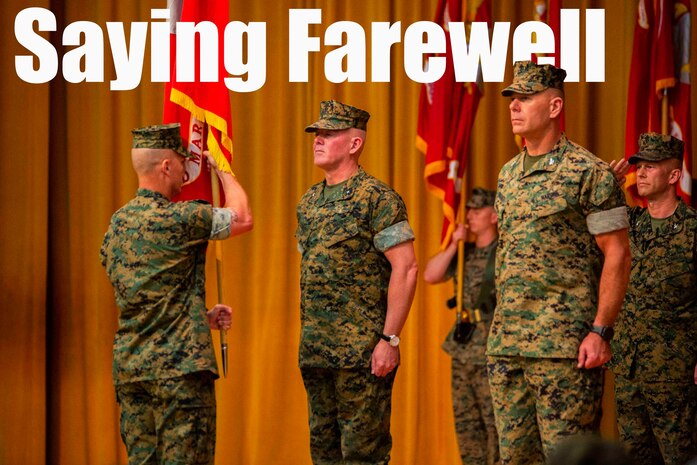 Sgt. Maj. James N. Calbough, left, sergeant major of 3rd Marine Logistics Group, prepares to pass the colors of 3rd MLG to Brig. Gen. Daniel B. Conley, center, outgoing commanding general of 3rd MLG June 1, 2018 on Camp Kinser, Okinawa, Japan. (U.S. Marine Corps photo by Pfc. Mark Fike)