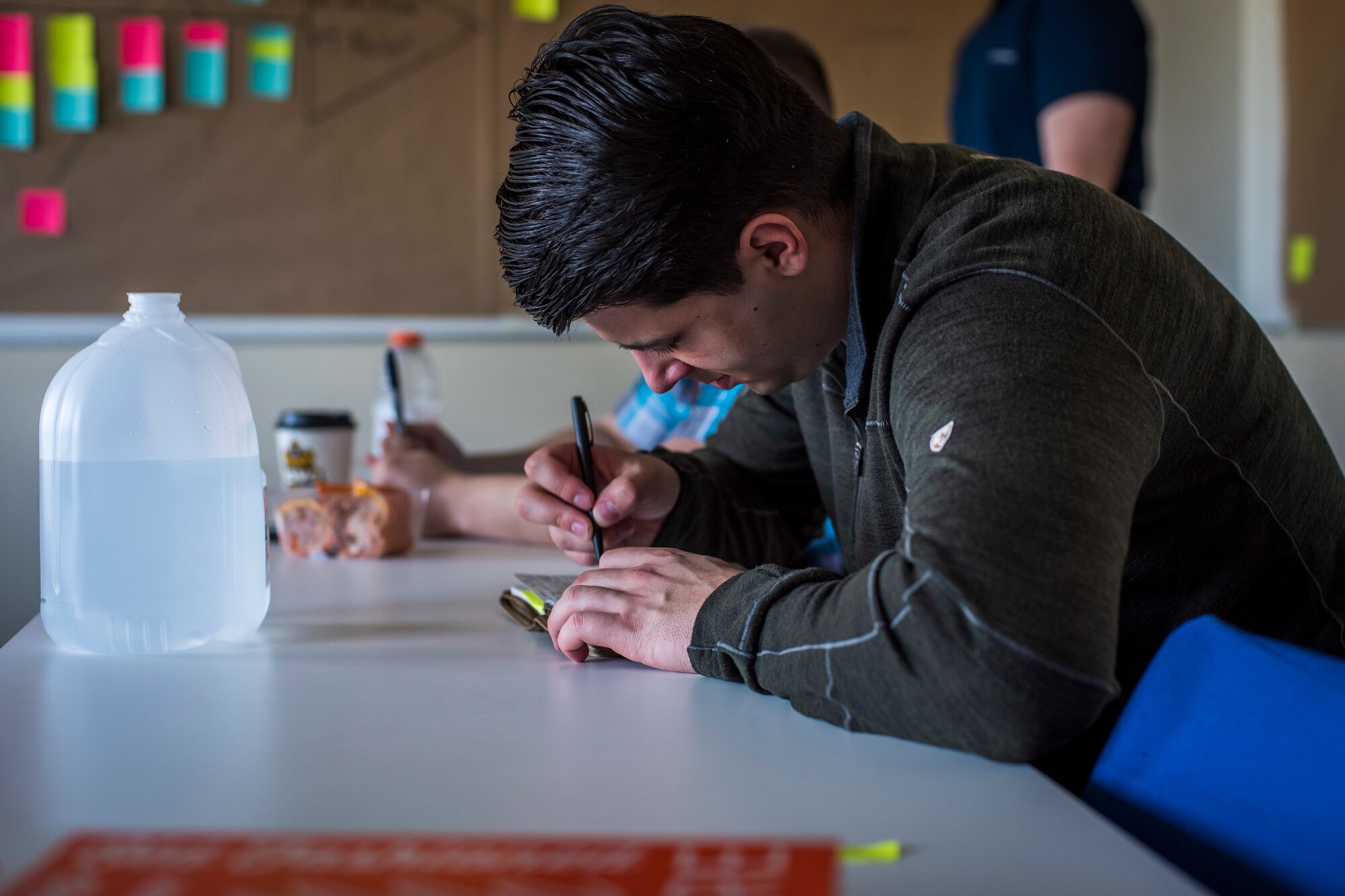 U.S. Air Force Senior Airman Daniel Ruzicka, a 35th Maintenance Squadron transient alert member, takes notes on how to effectively problem solve during the Continuous Process Improvement program at Misawa Air Base, Japan, May 22, 2018. The goal of CPI is to acknowledge shortcomings within squadrons and use an eight-step solution to resolve noted issues.