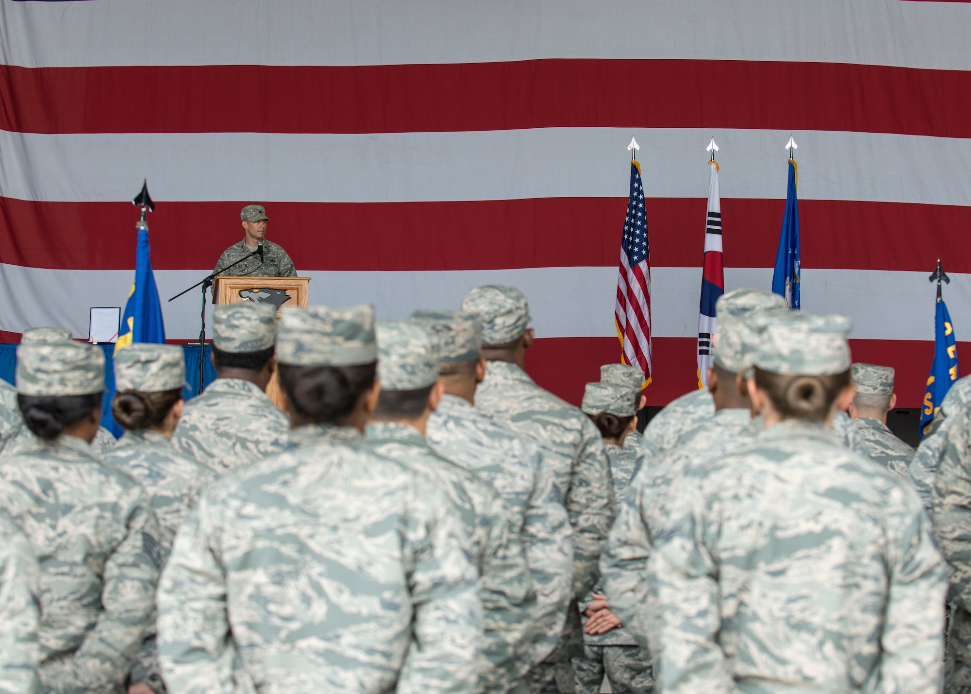 U.S. Air Force Col. Terrence Walter, 8th Mission Support Group commander, talks to the 8th Fighter Wing during a change of command ceremony at Kunsan Air Base, Republic of Korea, June 8, 2018. Walter received command of the 8th MSG from Col. Michael Zuhlsdorf during the ceremony and received the title of “Falcon”. (U.S. Air Force photo by Staff Sgt. Victoria H. Taylor)