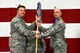 U.S. Air Force Maj. Timothy Liebold receives the 51st Munitions Squadron (MUNS) guidon from Col. Michael Hammond, 51st Maintenance Group commander, during a change of command ceremony at Osan Air Base, Republic of Korea, June 8, 2018.